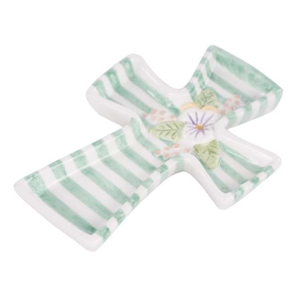 Cross-shaped ceramic dish with green stripes and a small floral motif