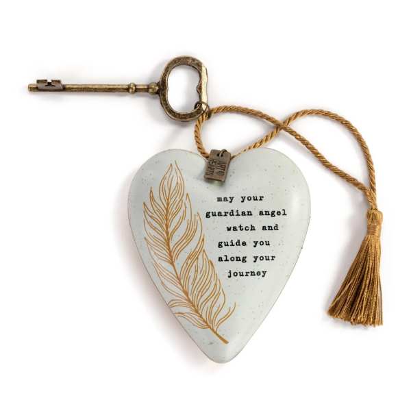 Heart-shaped hanging ornament with a key and tassel