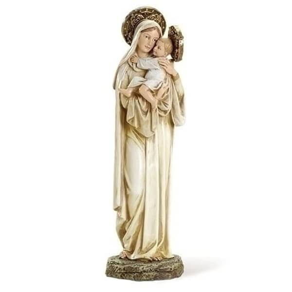 Religious statue of a woman holding a child on a stone base