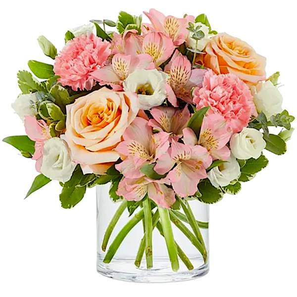 Pink and peach bouquet in a clear glass vase