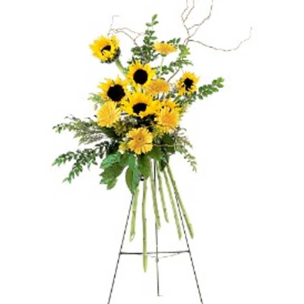 Tall yellow sunflower and daisy standing arrangement on a metal easel
