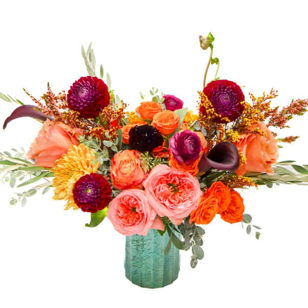 Bright mixed bouquet in a teal vase with roses and orange blooms