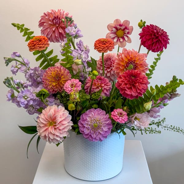 Colorful mixed bouquet in a white textured vase