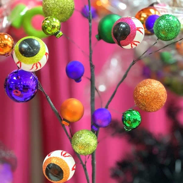Decorative Halloween eyeball picks in a glass vase