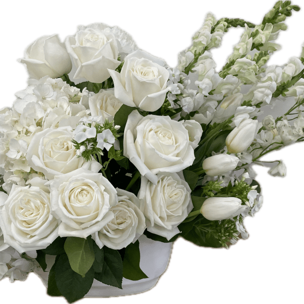 White roses and hydrangeas in a low white container