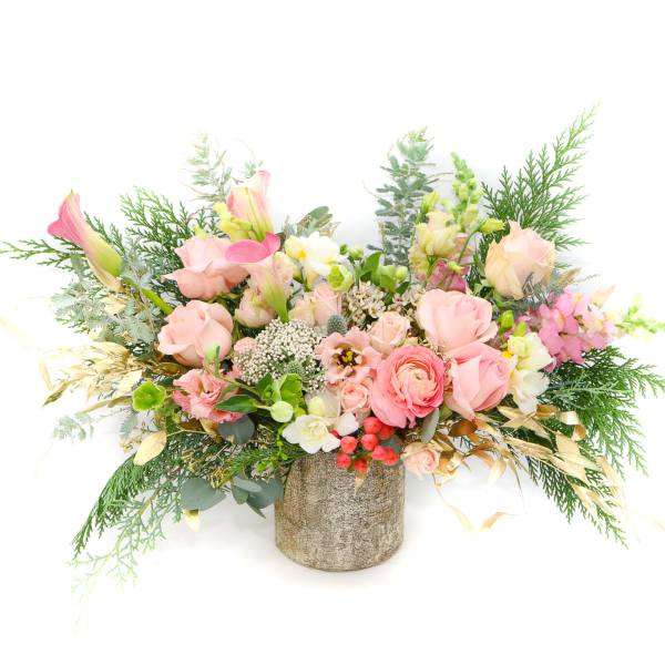 Pink and white floral arrangement in a textured vase