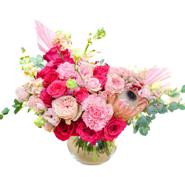 Pink and red rose bouquet in a glass vase