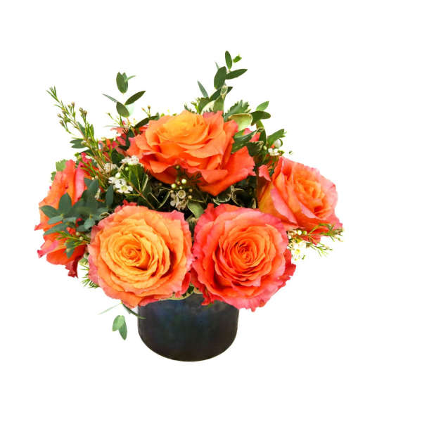 Orange rose arrangement in a black vase