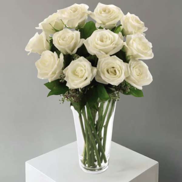 White rose bouquet in a clear glass vase