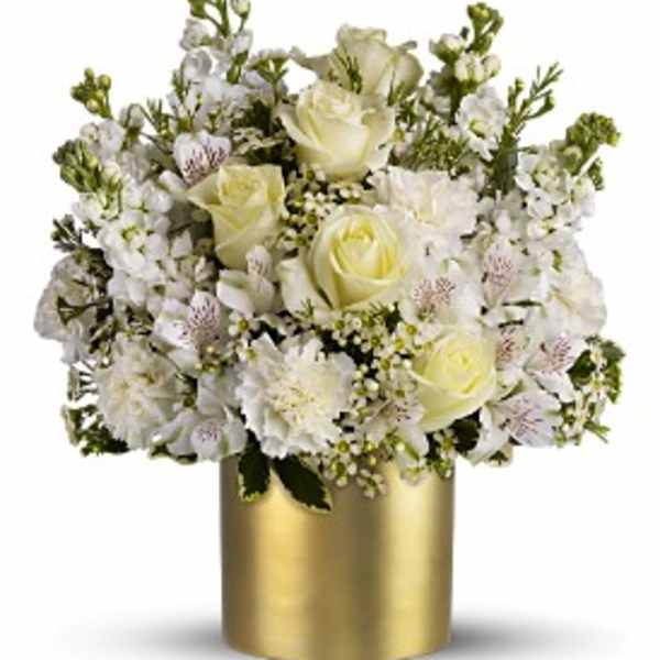 White rose and mixed white flower arrangement in a gold vase