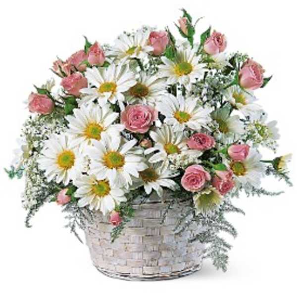 Pink roses and white daisies in a woven basket