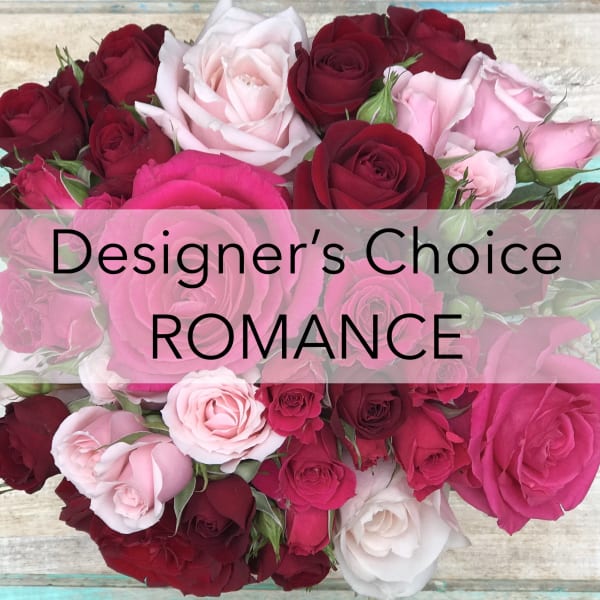 Assorted pink, red, and white roses arranged in a bouquet