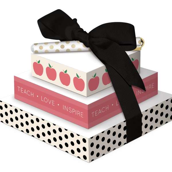 Stacked decorative gift boxes tied with a black ribbon