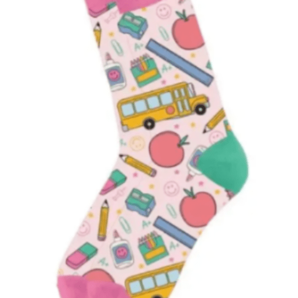 Pair of pink crew socks with colorful school-themed illustrations like buses, apples, and pencils