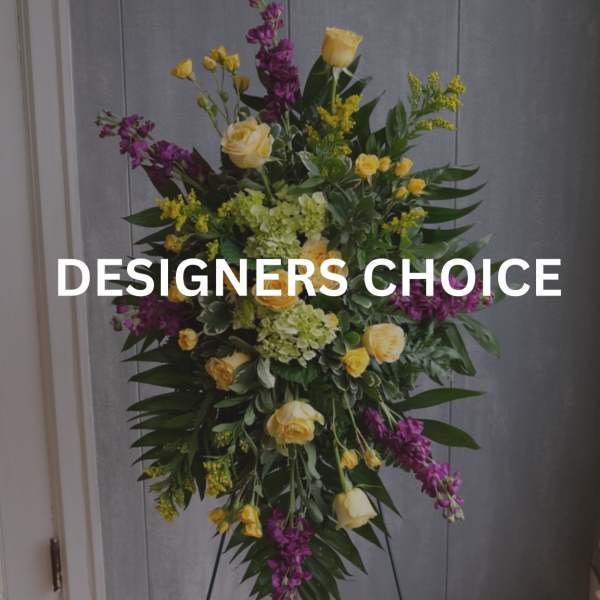 Tall floral standing spray with yellow roses and purple flowers