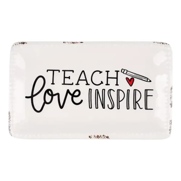 White tray with "Teach love inspire" text and a pencil graphic