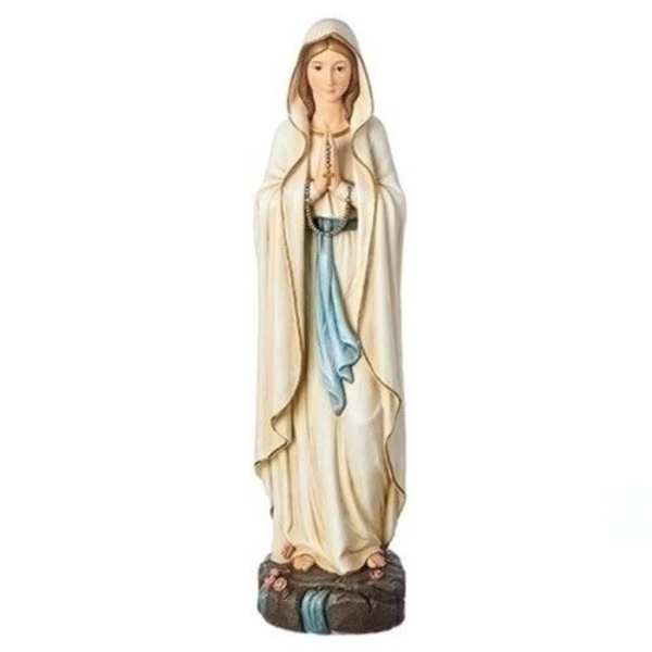 Statue of the Virgin Mary in a cream robe with blue accents