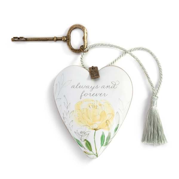 Heart-shaped hanging ornament with a key and tassel