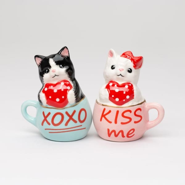 Two cat figurines in mugs with Valentine messages
