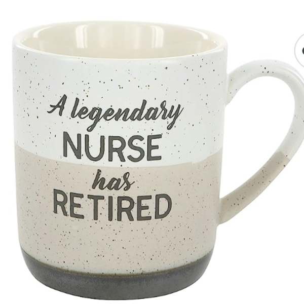 Speckled beige and white ceramic mug with the phrase 'A legendary nurse has retired' in black text.