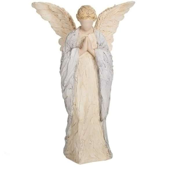 Cream-colored angel figurine with folded hands and large wings