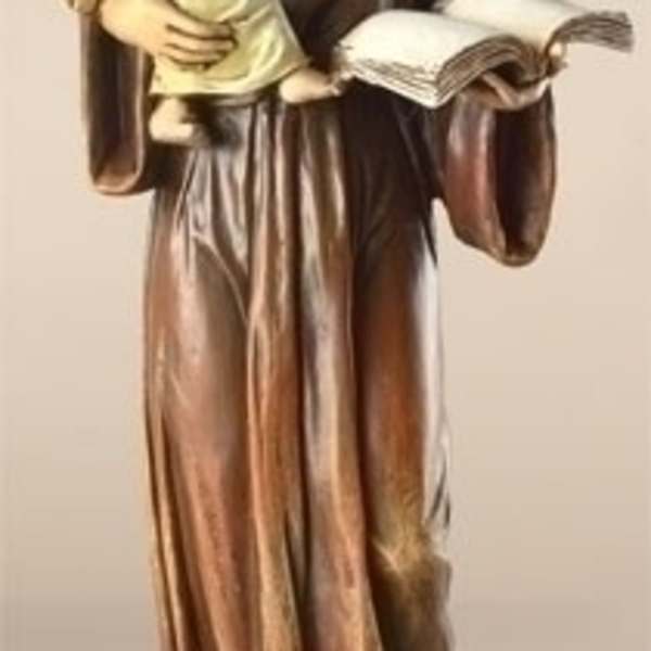 Statue of a robed woman holding a child and an open book