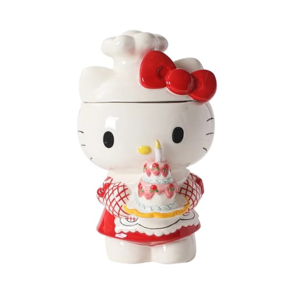 Hello Kitty figurine holding a birthday cake