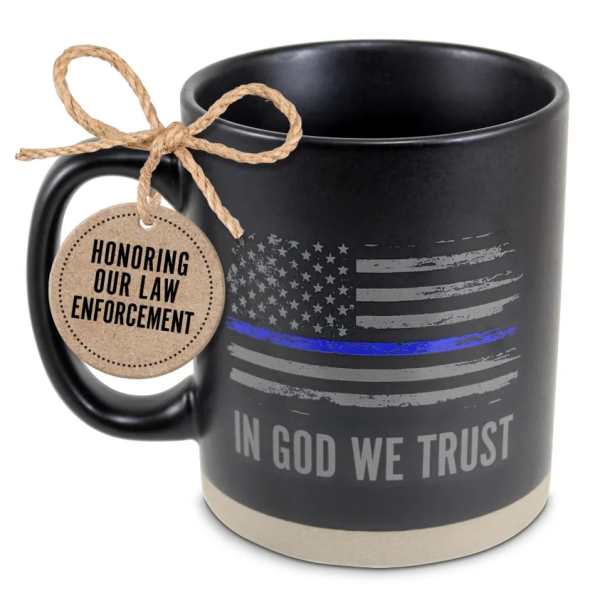 Black mug with a thin blue line flag design and a hanging tag