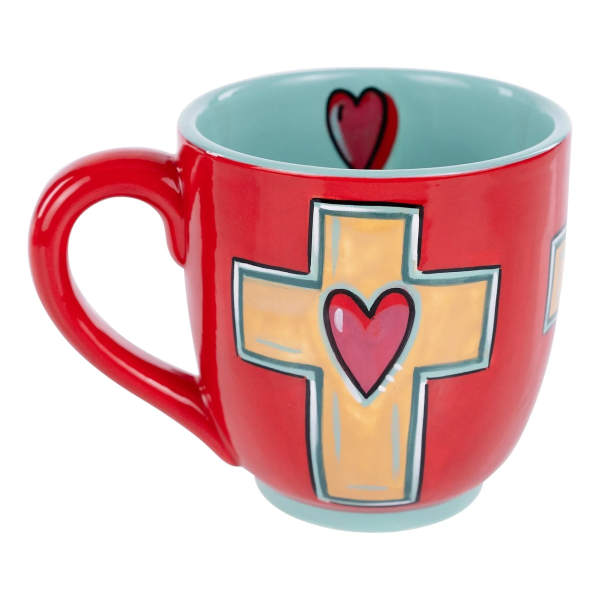 Red ceramic mug with a cross and heart design