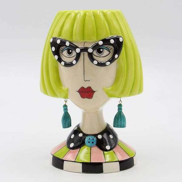 Decorative ceramic bust with lime-green bob hair and polka-dot glasses
