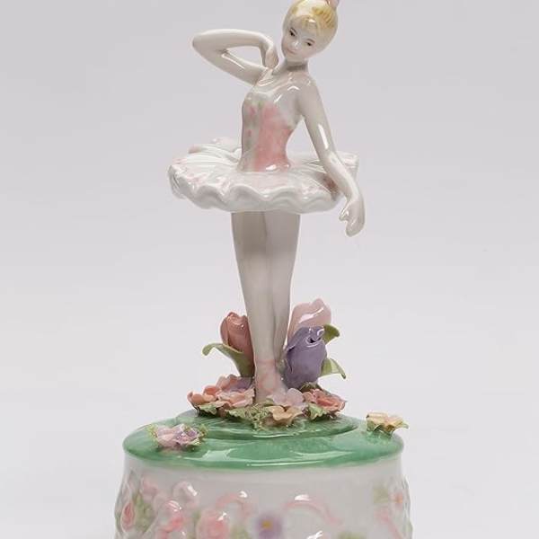 Porcelain ballerina figurine on a floral music box