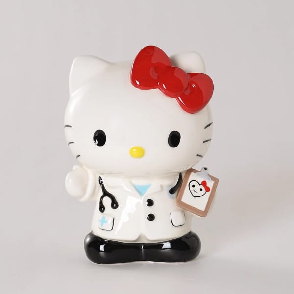 Hello Kitty figurine dressed as a doctor with a clipboard