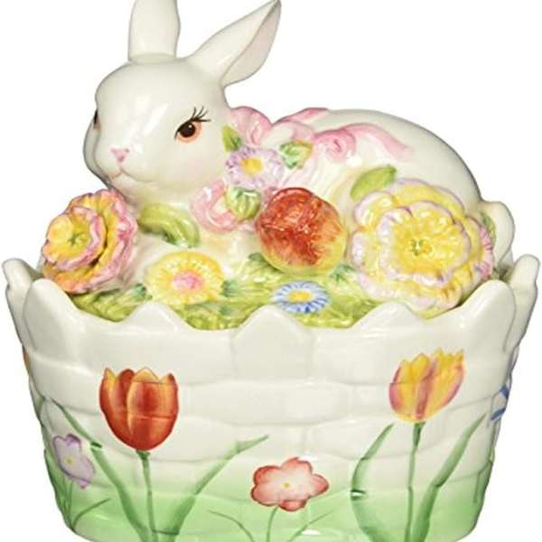 Ceramic bunny in a flowered basket with pastel eggs