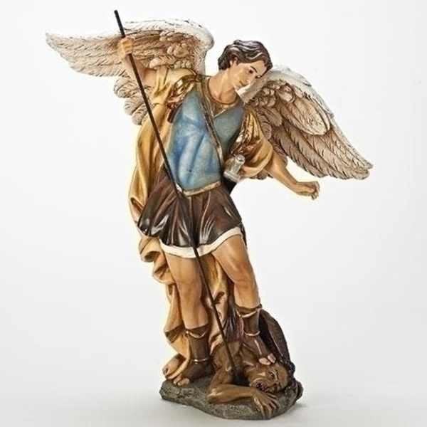 Angel figurine holding a staff and standing over a dog