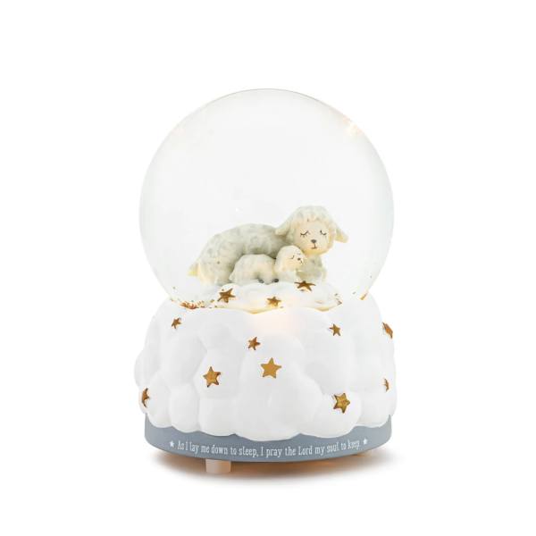 Snow globe with sleeping lamb figurines on a cloud base