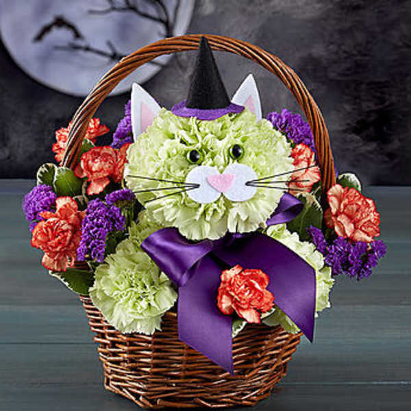 Cat-shaped floral basket with a witch hat and purple bow