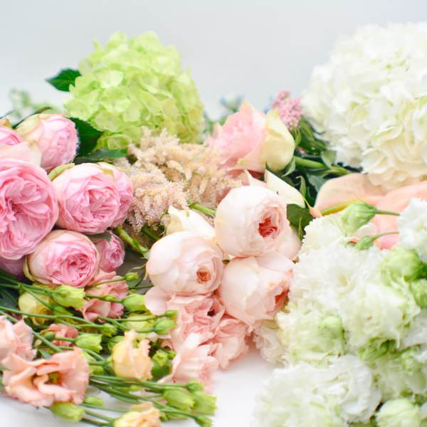 Assorted pink and white flowers arranged in clusters