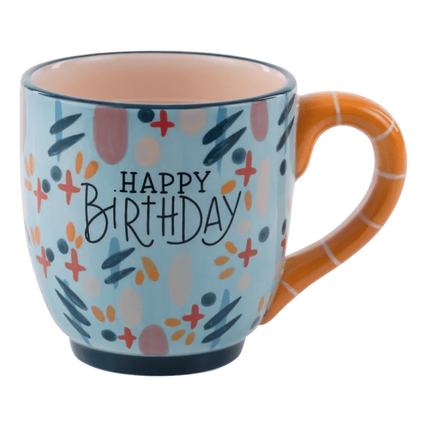 Ceramic mug with "Happy Birthday" text and colorful abstract pattern