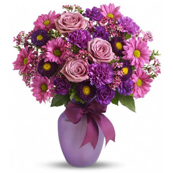 Pink and purple bouquet in a lavender vase with a ribbon