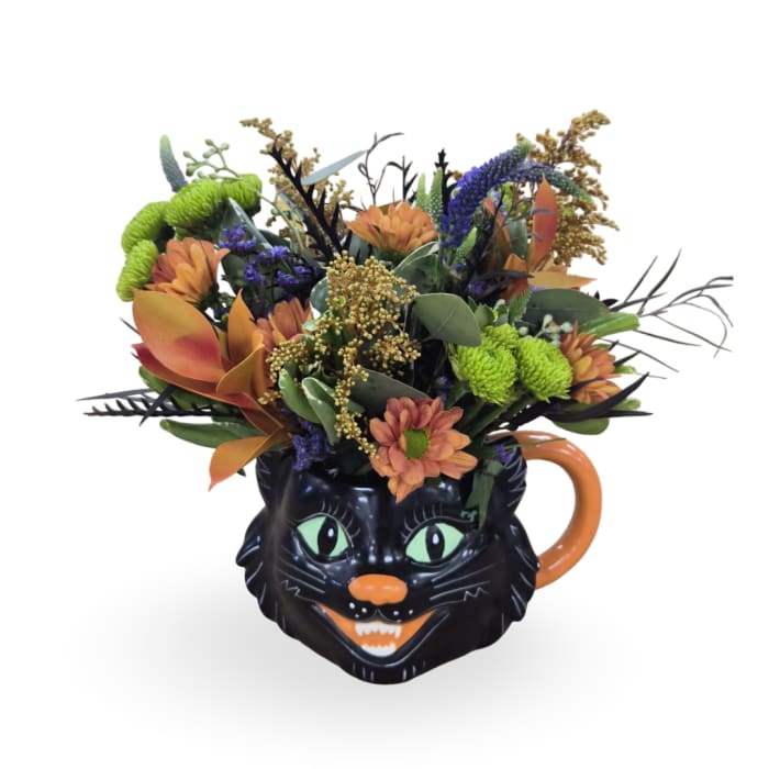 Bouquet in a black cat mug with orange and green flowers