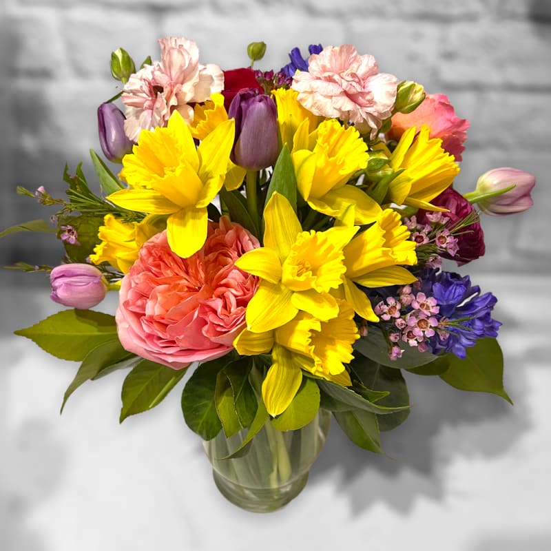Colorful mixed bouquet in a clear glass vase