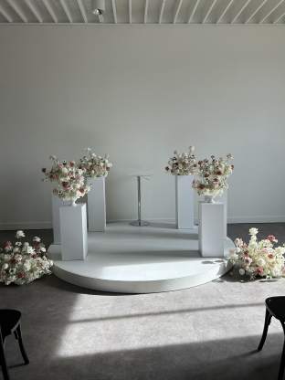 White Stand Rentals with Flowers 