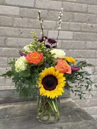 A sunflower “Happy” floral design