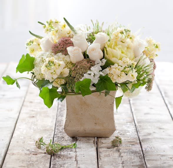 This creamy, buttery colored arrangement with stock, roses, hydrangea and more is