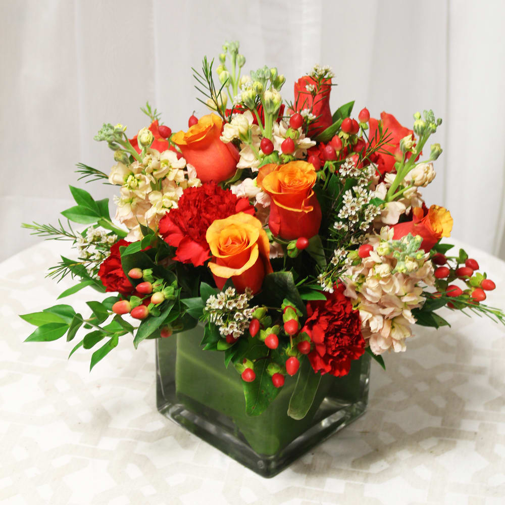 Dazzling oranges and reds really give this arrangement the perfect glow for