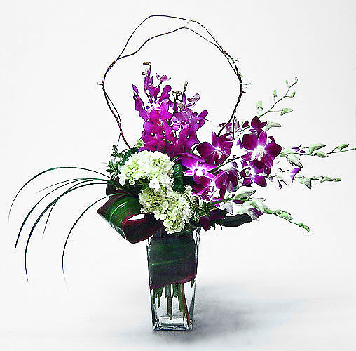 Square vase  with Vibrant Dendrobium orchids purple with green hydrangea and