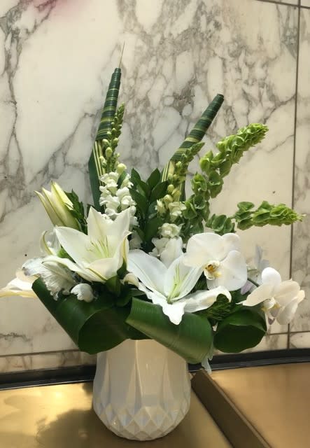 Soft pale snap dragons, lilies and orchids.  So beautiful and unique