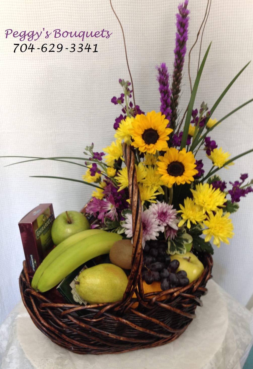 Basket of delicious fruits, including but not limited to, apples, bananas, grapes