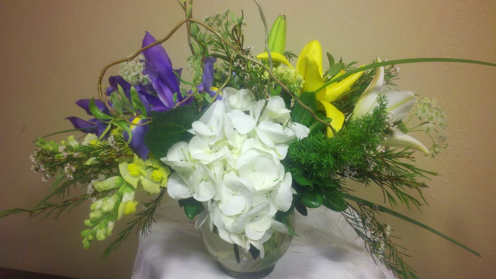 Mixed spring flowers to brighten an office desk or a centerpiece for