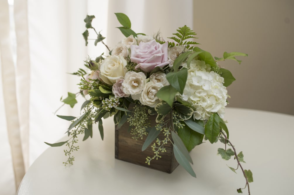 This natural design features pastel blooms, muted tones and lush greens. 